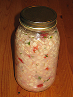 photo of corn, tomato, onion melange in canning jar