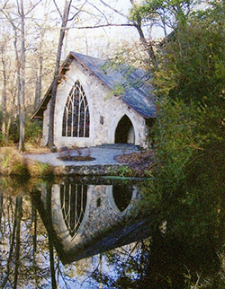 Small white chapel at the water's edge