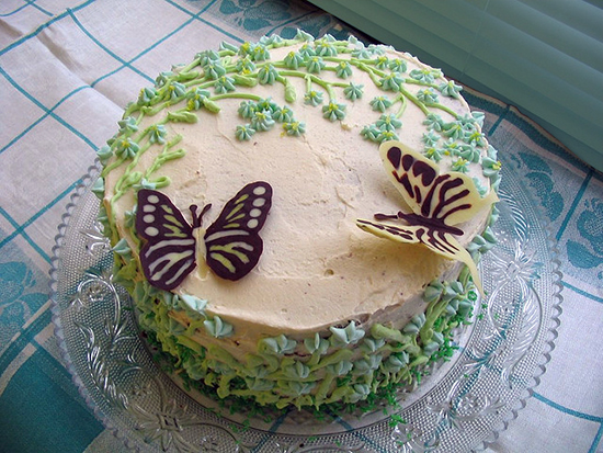 photo of cake with flowers and butterflies