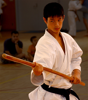 Kazuma Nitta performs a Kubudo Kata with a staff