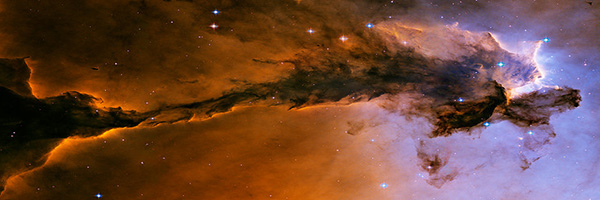 Lavender and orange nebula cloud against starfield